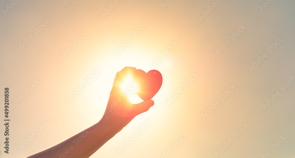 © kieferpix - Love symbol. Heart against beautiful nature sunset. © kieferpix - Love symbol. Heart against beautiful nature sunset.