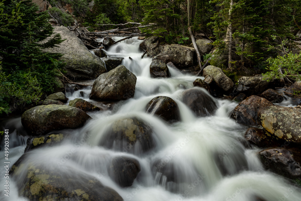 Water Rushes Over Boulders In Unknown Creek