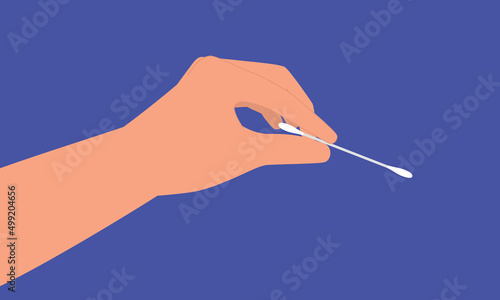 Close-Up View Of A Person’s Hand Holding A White Cotton Bud.