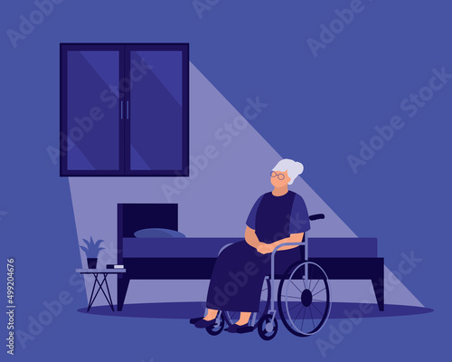 Lonely Senior Woman With Wheelchair Looking At The Window At Night.