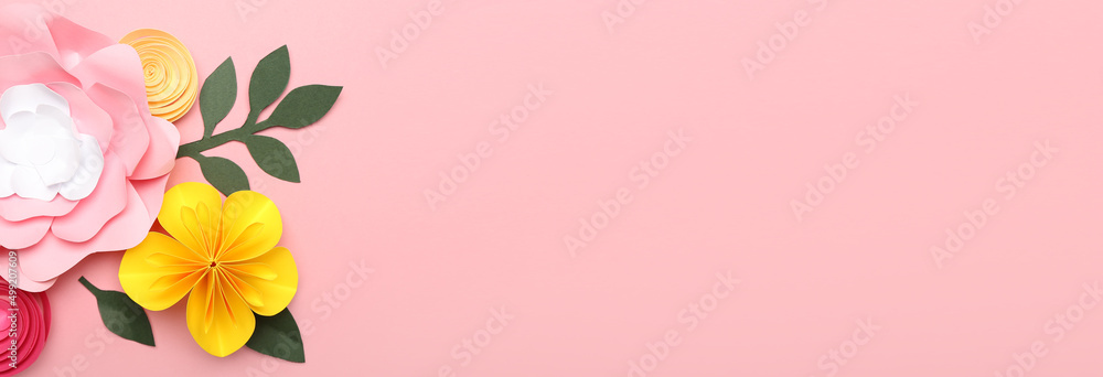 Naklejka premium Beautiful handmade paper flowers on pink background with space for text
