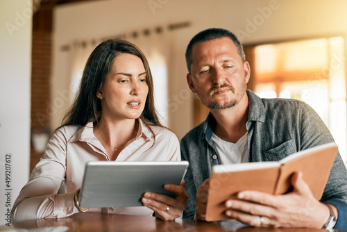 We have to see what we can do about this plan. Cropped shot of a married couple planning their financial budget at home. © K Seisa/peopleimages.com