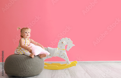 Adorable baby girl with pil...
