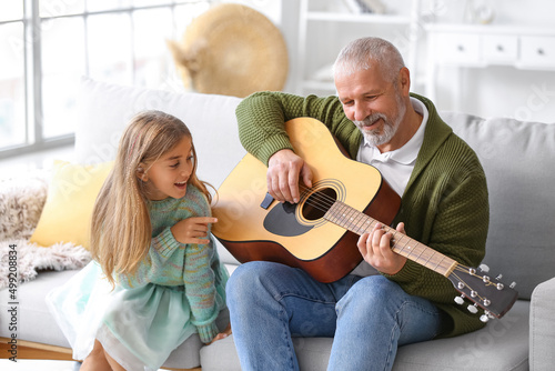 Senior man with his little ...
