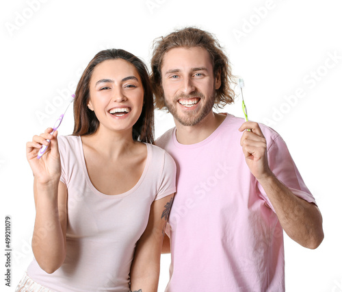 Happy young couple with too...