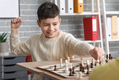 Happy little boy playing ch...