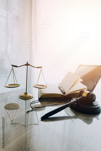 Canvas Print law books and scales of justice on desk in library of law firm