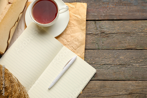 Notebook, old paper, cup of...