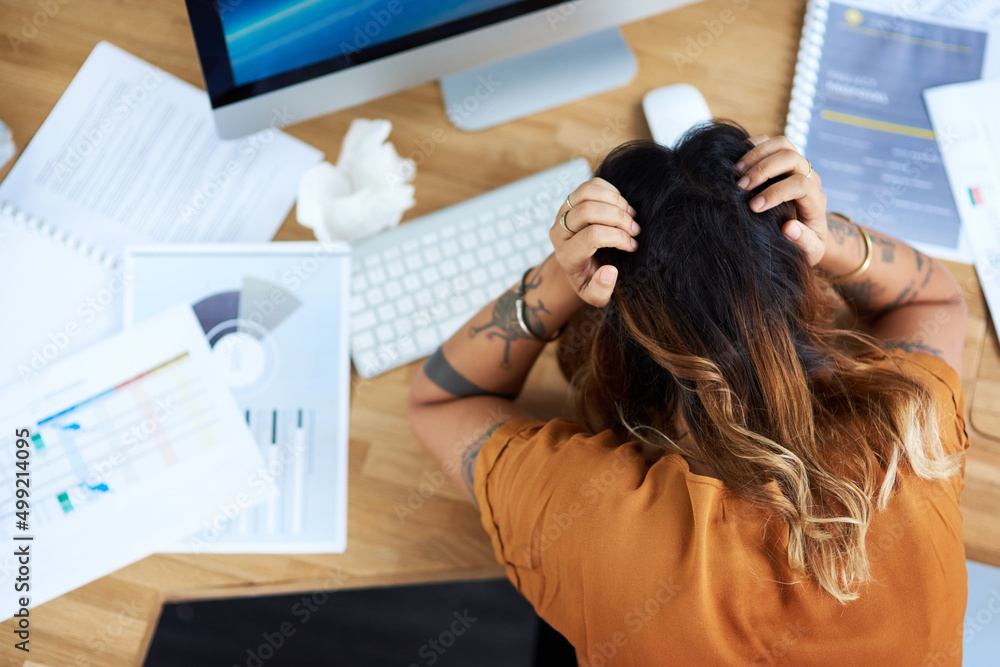 Naklejka premium I am way too stressed today. Cropped shot of an unrecognizable businesswoman suffering from a headache while in her office during the day.