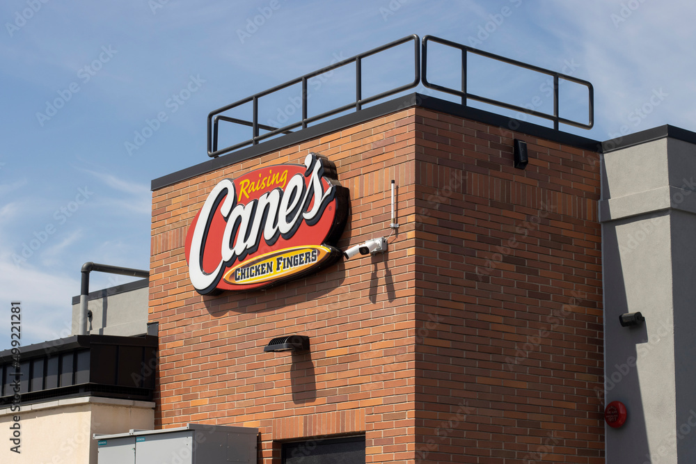 Tulare, CA, USA Mar 26, 2022 Closeup of the Raising Cane's logo seen