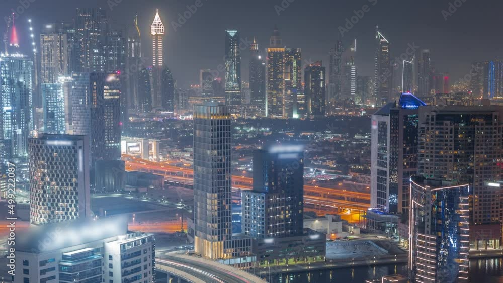 Skyline with modern architecture of Dubai business bay towers night timelapse. Aerial view Skyline with modern architecture of Dubai business bay towers night timelapse. Aerial view