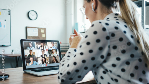 Принти на полотні Woman has video call conference with her remote team