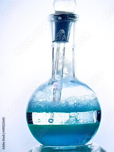 Glass flask with a chemical reagent. photo