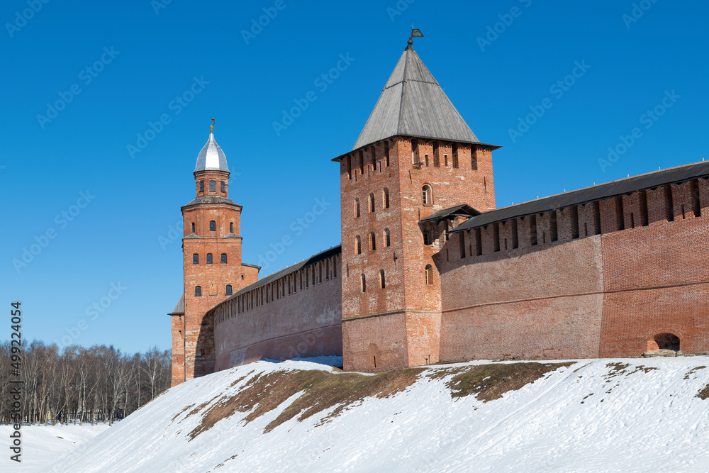 Fototapeta premium Two ancient towers of the Detinets of Veliky Novgorod on a sunny March day. Russia