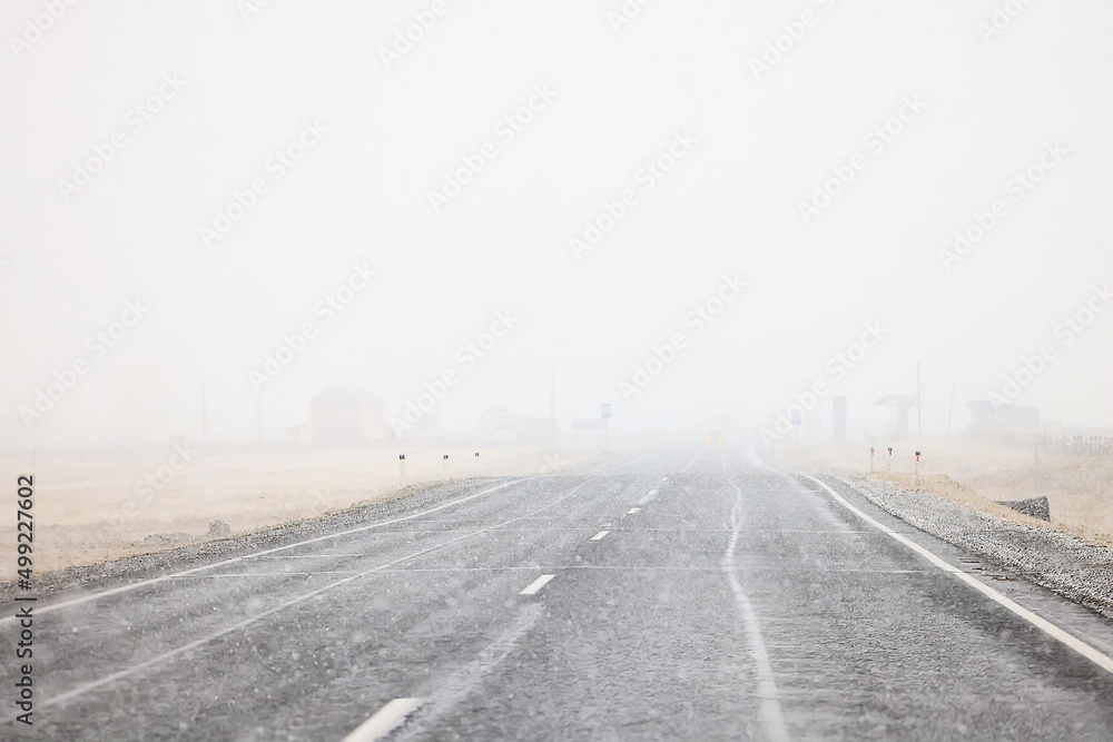 Naklejka premium winter highway snowfall background fog poor visibility