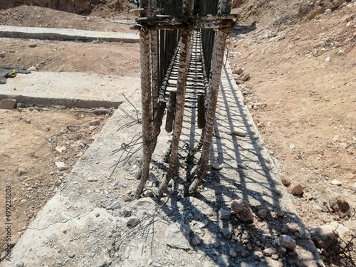 Offset pillar case of reinforcement in the concrete column on the construction site. Eccentricity. devil engineer concept.
