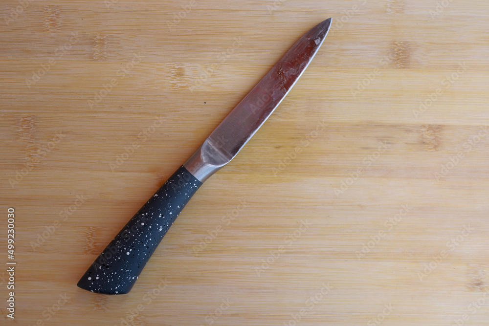 knife on a wooden table knife on a wooden table