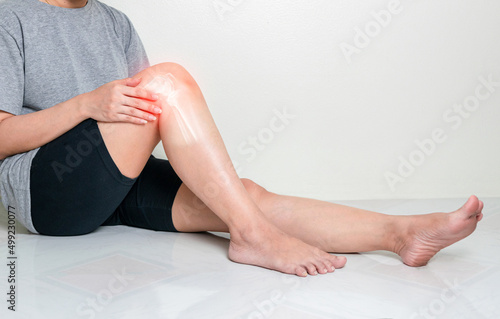 Human leg osteoarthritis inflammation of bone joints on white background