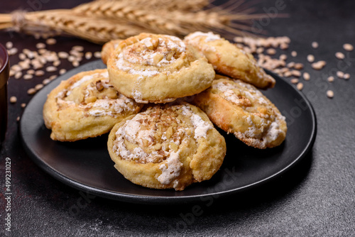 Homemade glazed puff pastry cinnamon rolls with custard and raisins