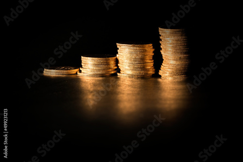 Gold coins on black background. Stock Images.