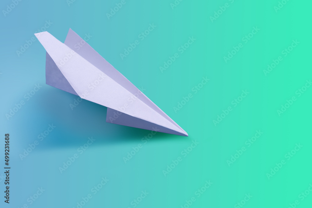 Naklejka premium Paper airplane on a tone-harmonious background, toned