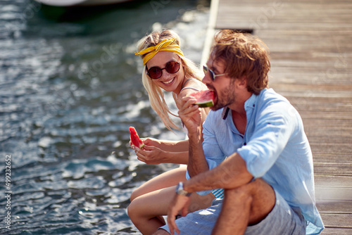 Fototapeta Smiling  man and woman enjoying together at holiday
