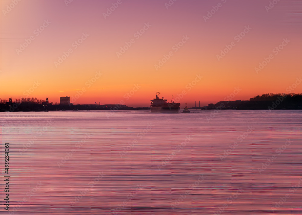 Hamburg Elbe burning sunset view with a boat moving as a silhouette