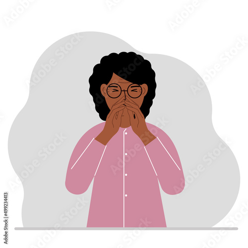 The woman covers his nose with his hands. The concept of a sick person, sneezes, seasonal allergies, bad smell.
