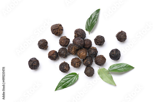 Flat lay of black peppercorns (black pepper) with leaves isolated on white background. photo