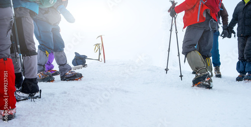 Fotobehang Group of tourists with hiking equipment for winter expedition