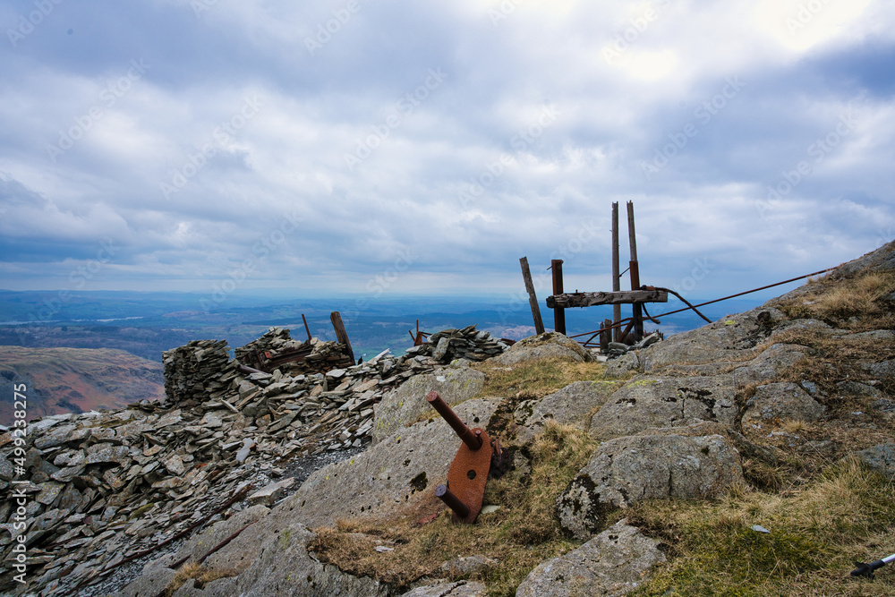 Old slate mining equipment abandoned on Lake District fells above Coniston Old slate mining equipment abandoned on Lake District fells above Coniston