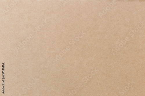 Brown paper background on the cover of the notebook. © prasong.