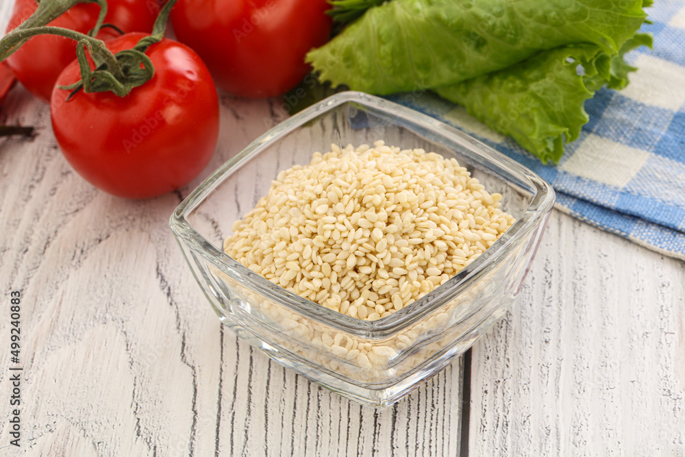 Raw sesame seeds in the bowl Raw sesame seeds in the bowl