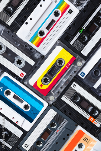 Top view of many different vintage cassette tapes forming a seamless pattern. Music icon of the 80s and 90s. Close up.