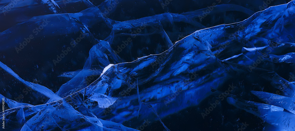 Naklejka premium ice texture cracks baikal, abstract background winter ice transparent blue