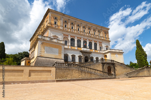 The Palazzo Farnese or Villa Farnese in Caprarola Viterbo, considered one of the best examples of a Renaissance mansion on a summer day with blue sky and clouds. The facade dominates the hill.