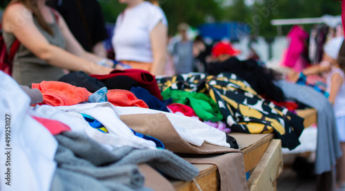 Tableau sur toile Multi Colored Clothes Hanging At Market Stall For Sale
