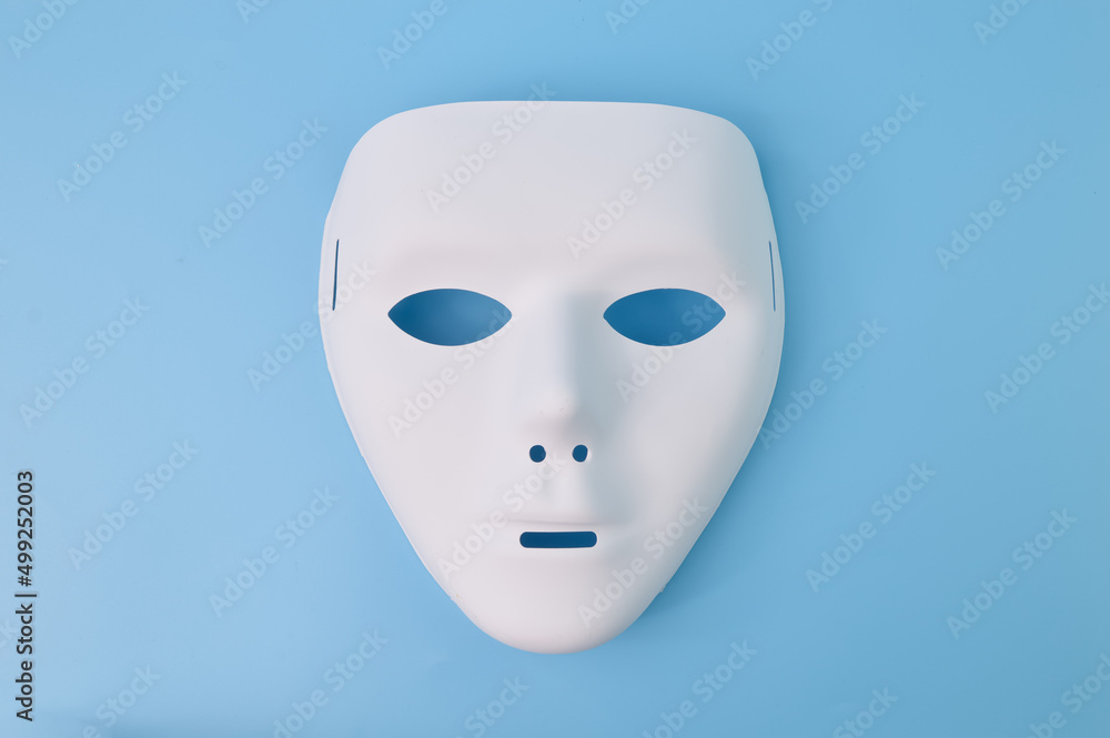 Anonymous mask isolated on a blue background Anonymous mask isolated on a blue background