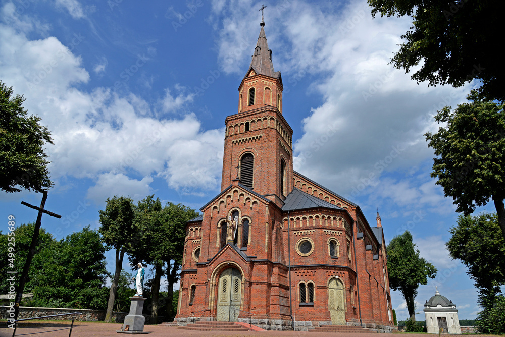 Obraz premium General view and architectural details of a close-up of the Catholic church of St. Michael the Archangel built at the turn of the 19th and 20th centuries in Jabłonka Koscielna in Podlasie, Poland.