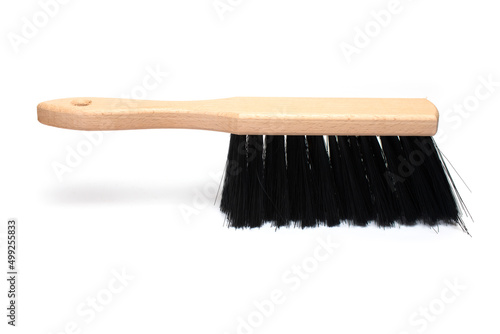 closeup hand broom wooden handle white background