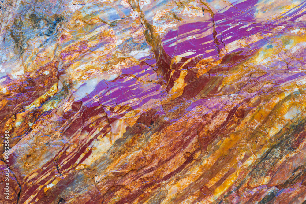 Close up of colourful layers of Jasper