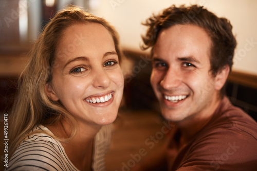 This is our favourite hangout. Portrait of a happy young couple spending time together at a cafe.