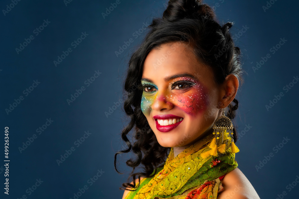 Fototapeta premium A gorgeous Young model beautiful woman or girl with perfect art creative makeup like a butterfly.