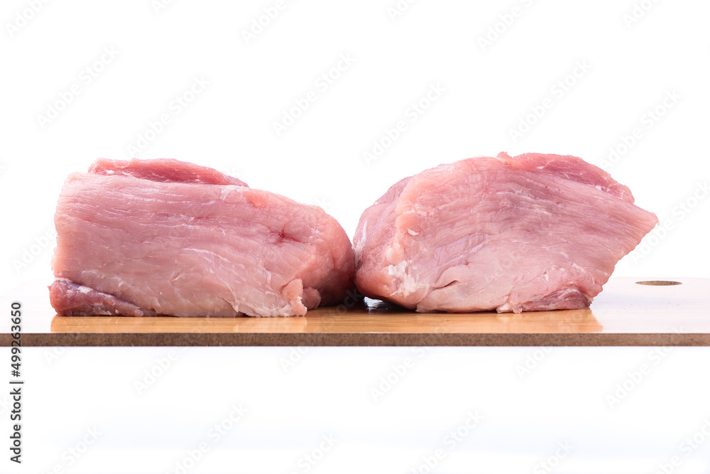 Cutting board with pieces of raw meat over white background. Cutting board with pieces of raw meat over white background.