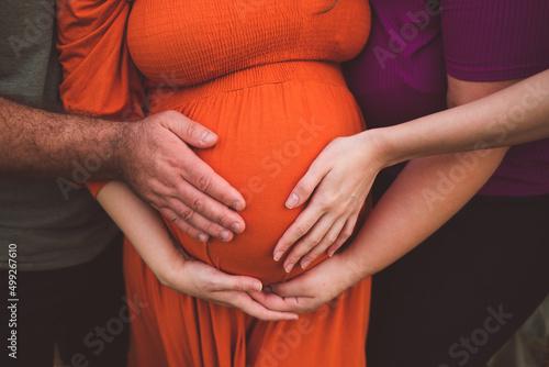 maternity photo shoot with hands on belly 