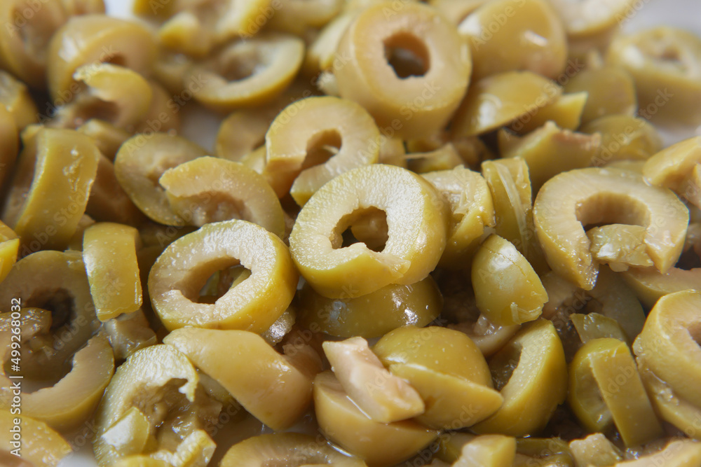 slice of olive in a bowl close up slice of olive in a bowl close up