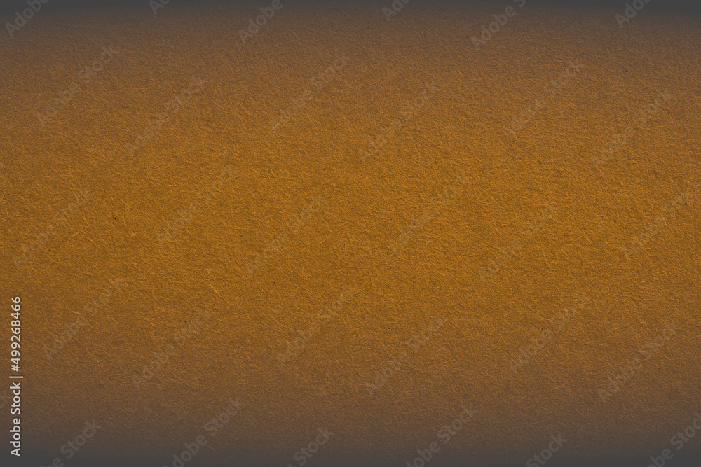 The surface of bright brown cardboard. Textured pasteboard background