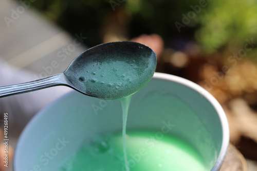 Spoon with avocado cream sauce