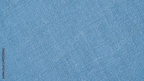 Light blue woven surface closeup. Linen textile texture. Fabric background. Textured braided wallpaper. Macro