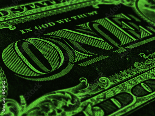 American paper money. 1 US dollar bill. Word one close-up. Dark green inverted background or wallpaper. USA economy and business. Federal reserve note. Macro